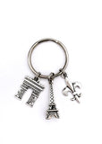 Paris France themed keychain. Includes Eiffel Tower, Arc de Triomphe, and Fleur de Lis. Gift for French lover.