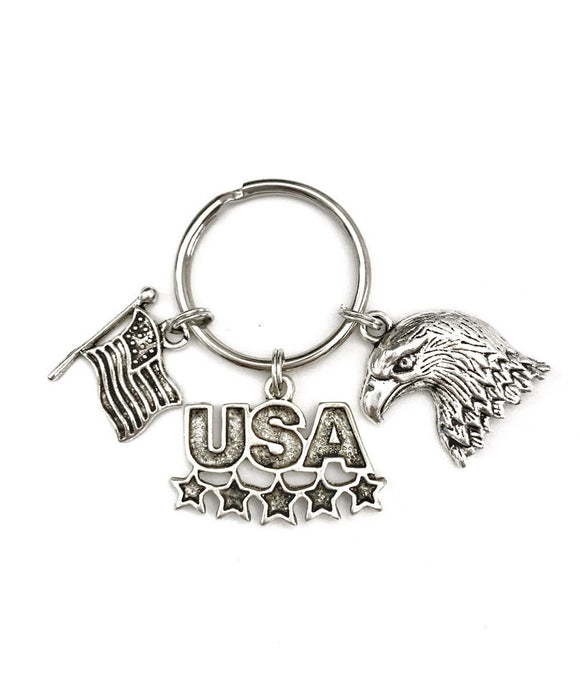 USA America themed keychain. Includes Bald Eagle, American Flag, and USA with Stars Charms. American Gift. Born in the USA.