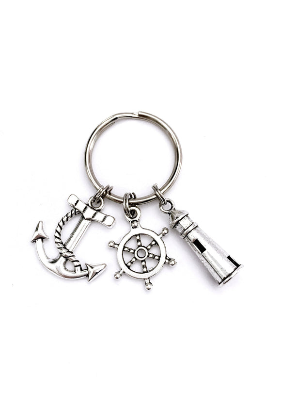 Nautical themed keychain. Includes Anchor, Ship Wheel, and Lighthouse. Marine gift, Beach House Hostess Gift, Vacation House Key.