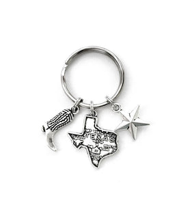Texas themed keychain. Includes State of Texas, Lone Star, and Cowboy Boot charms. Dallas, Houston, Austin, San Antonio Gift.