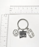 New Mexico themed keychain. Includes State of New Mexico, a Cactus, and Sunshine charms. Albuquerque, Santa Fe, Las Vegas Gift.