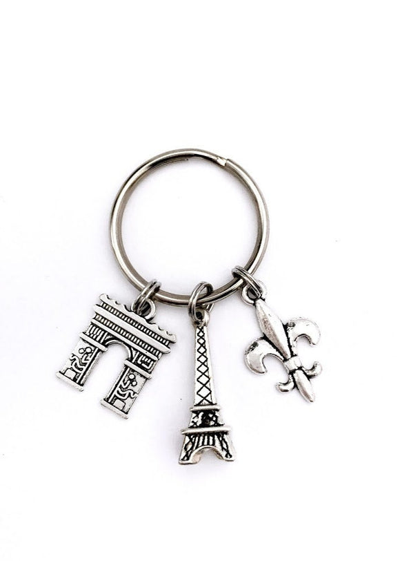 Paris France themed keychain. Includes Eiffel Tower, Arc de Triomphe, and Fleur de Lis. Gift for French lover.