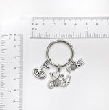 Golf themed keychain. Includes I Love to Golf, Fore, and 18th Green charms. Golfer and Golf Enthusiast Gift.