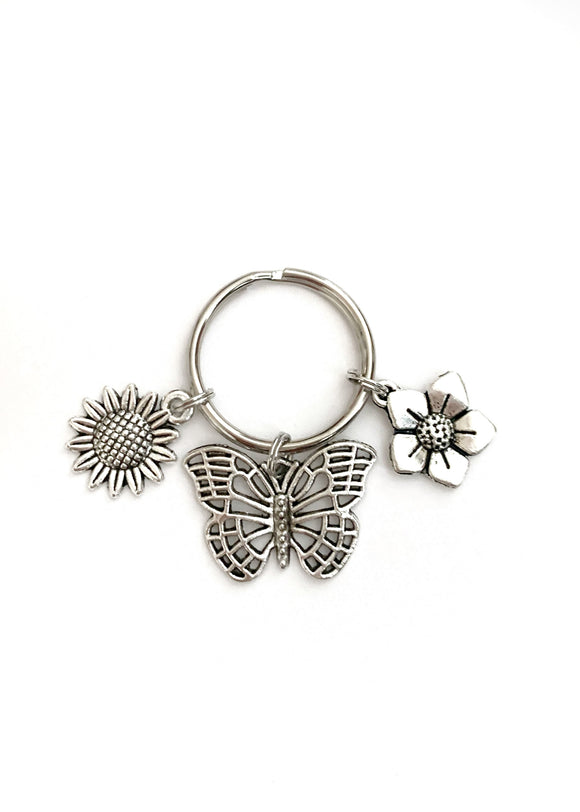 Butterfly and Flower themed keychain. Gift for Butterfly Lovers, Bag and Key Identifier. Includes Butterfly and Two Flower Charms.