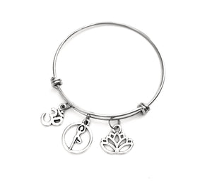 Yoga themed bracelet. Includes Ohm symbol, Lotus Flower, and I Love Yoga Charms. Yoga Teacher gift.
