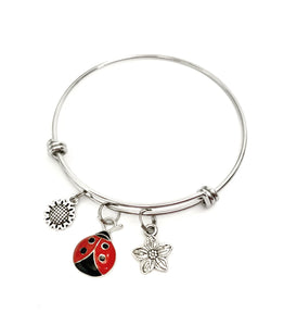 Ladybug and Flower themed charm bracelet. Gift for ladybug Lovers. Includes Ladybug and Two Flower Charms.