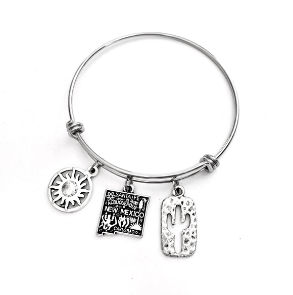 New Mexico themed bracelet. Includes State of New Mexico, a Cactus, and Sunshine charms. Albuquerque, Santa Fe, Las Vegas Gift.