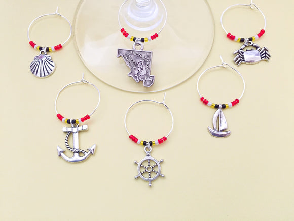Maryland Wine Charms: Maryland Shore themed Wine Charms. Set of 8. Includes State of Maryland, Crab, Sailboat, Seashell, etc. Maryland Flag Bead Colors.