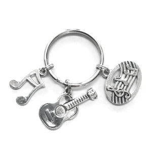 Music Lover themed keychain. Includes Musical Notes, Beamed Note, and Guitar charms. Music lover hostess gift.